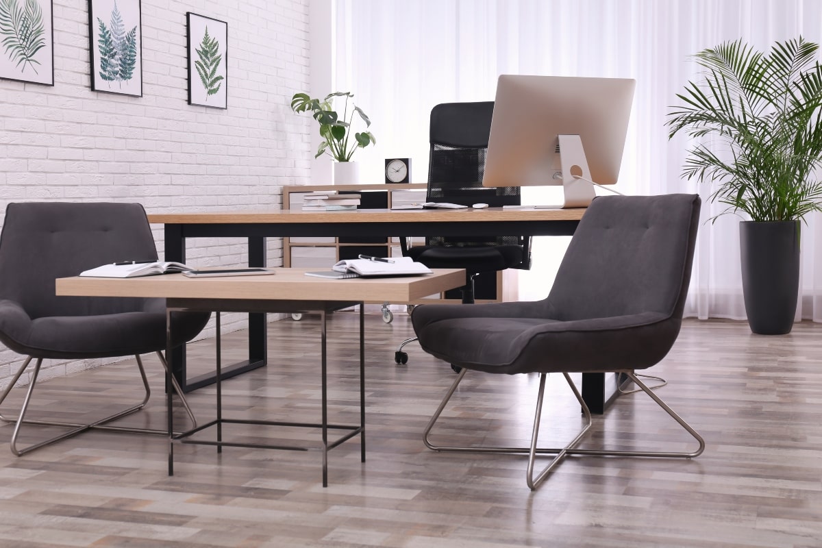 Modern office setup with office chairs and minimalist desk, highlighting ergonomic furniture and stylish design.