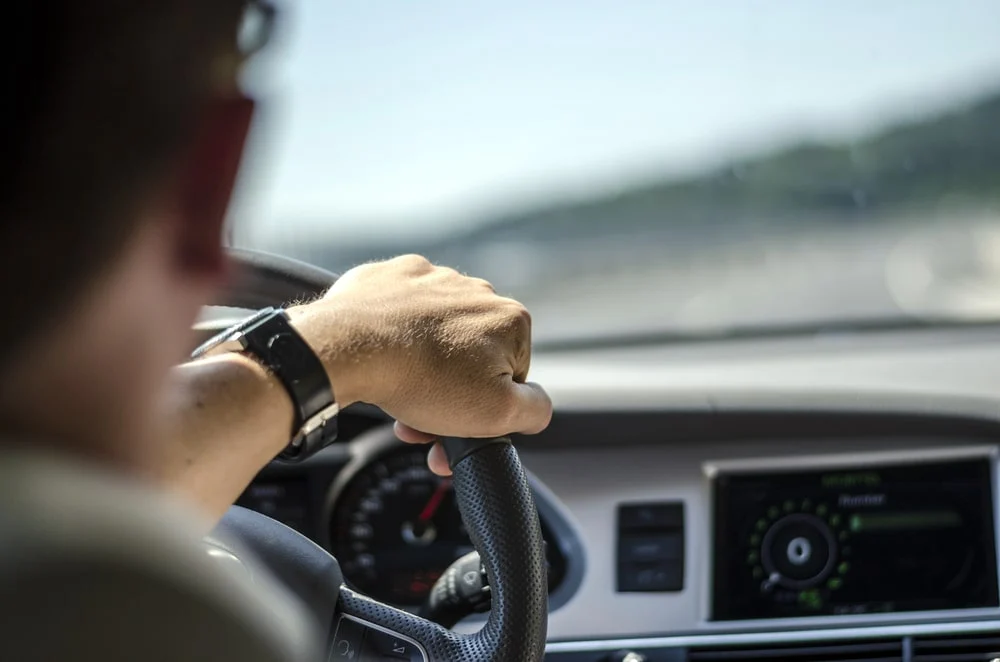 A man drives an EV