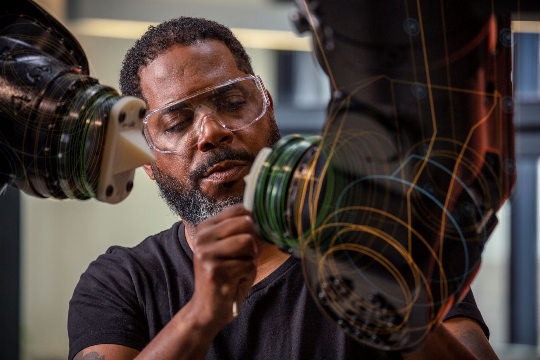 Man working in the robotics lab at the Autodesk San Francisco Technology Center