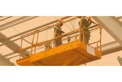 Two workers on a scissor lift