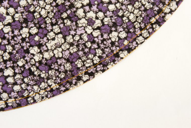 Narrow double fold hem on a curve