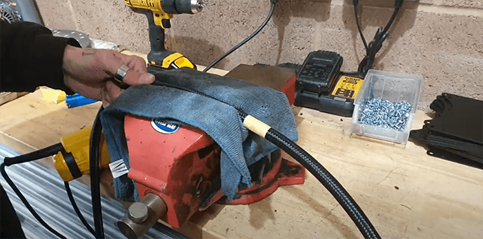 place the AN braided hose in the vice