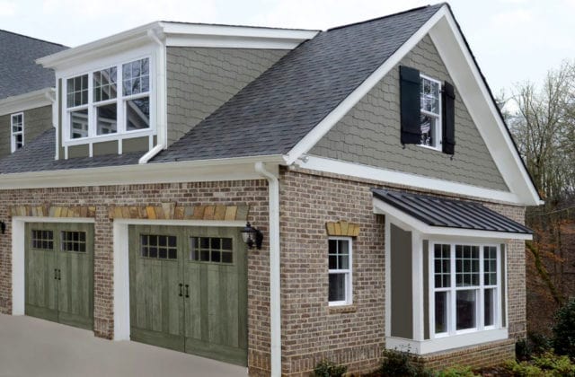 Two green garage doors that are a part of the American Farmhouse door series