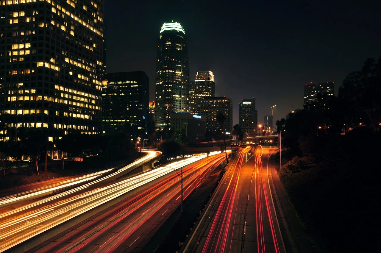 Highway with a flash of cars passing by.