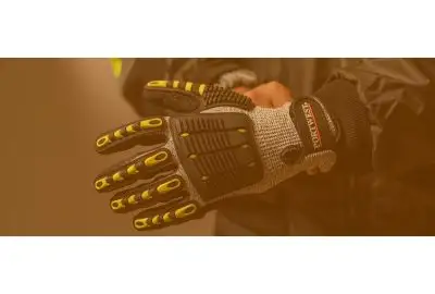 Person wearing impact-rated gloves