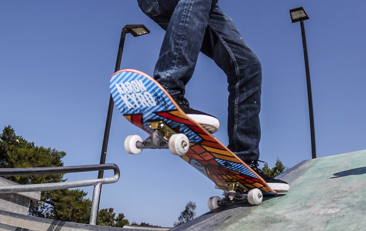 Underside of skateboard showing a 3D-printed, generatively designed skateboard truck