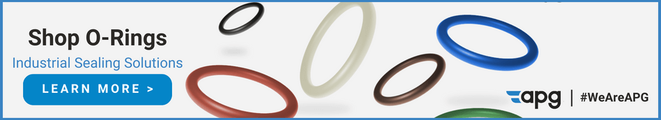 Multi colored O-rings floating against a grey background.