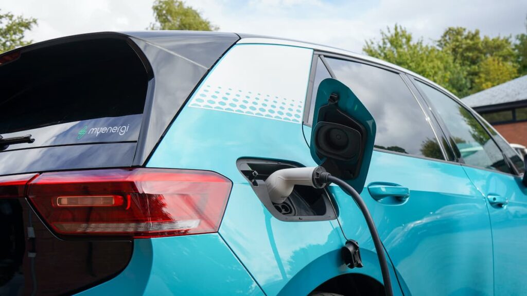 Electric car being charged at a charging station