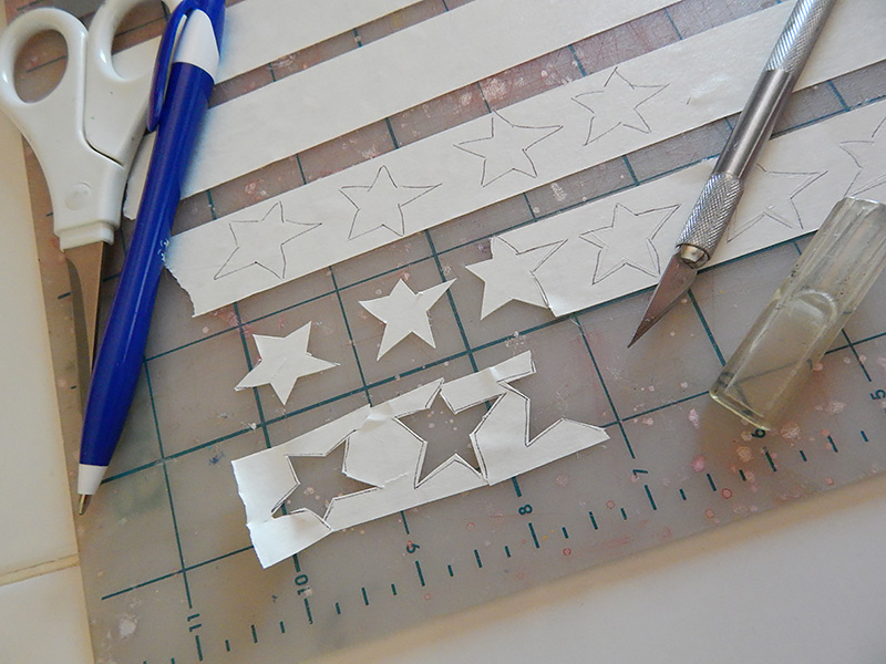 Use exacto blade to score the inside of each star shape.