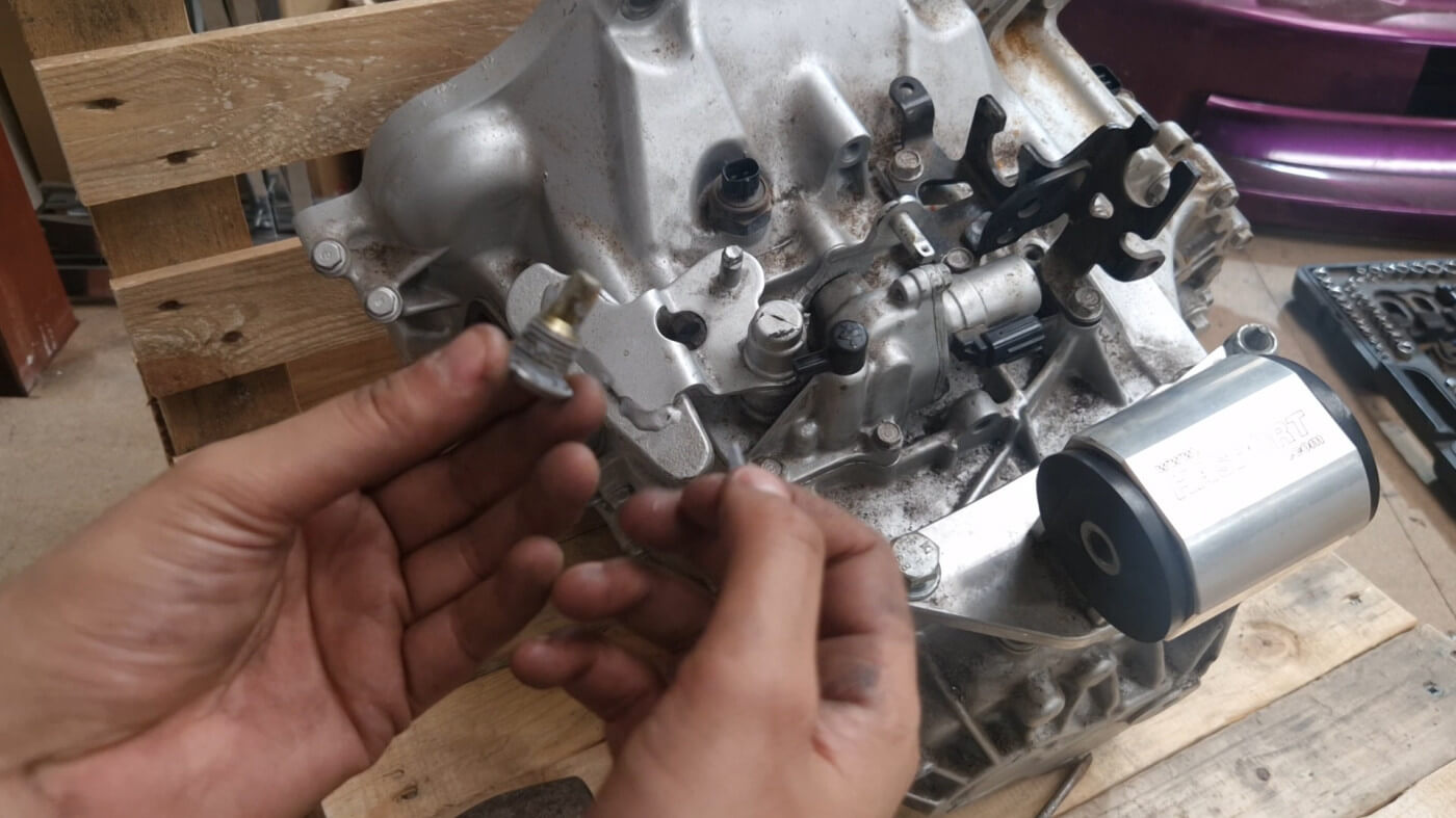 put a small amount on hondabond on this bolt