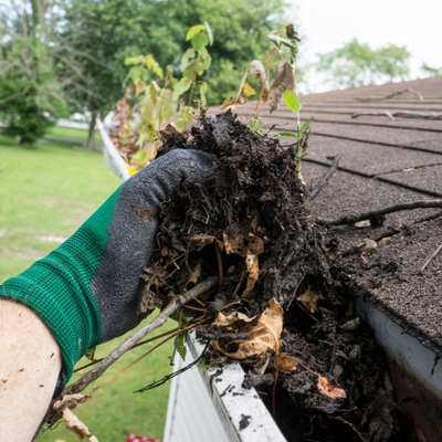 image of cleaning guttering for keeping your conservatory guttering clean blog