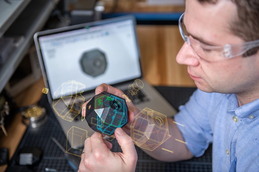 Designer Examining Product Prototype
