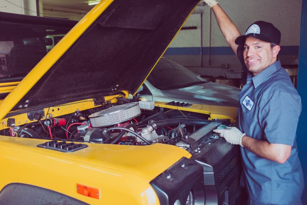 A mechanic examining a car engine