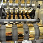 ProÂ® Sheen being slit on a narrow web slitter