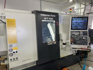 A brand-new Nakamura WT100 CNC Lathe gleaming in pristine condition within the Machining Concepts workshop.