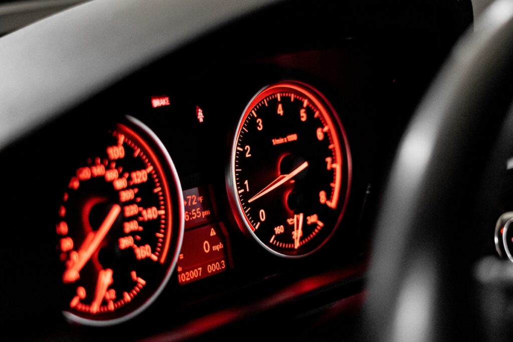 An instrument cluster with the lights on.