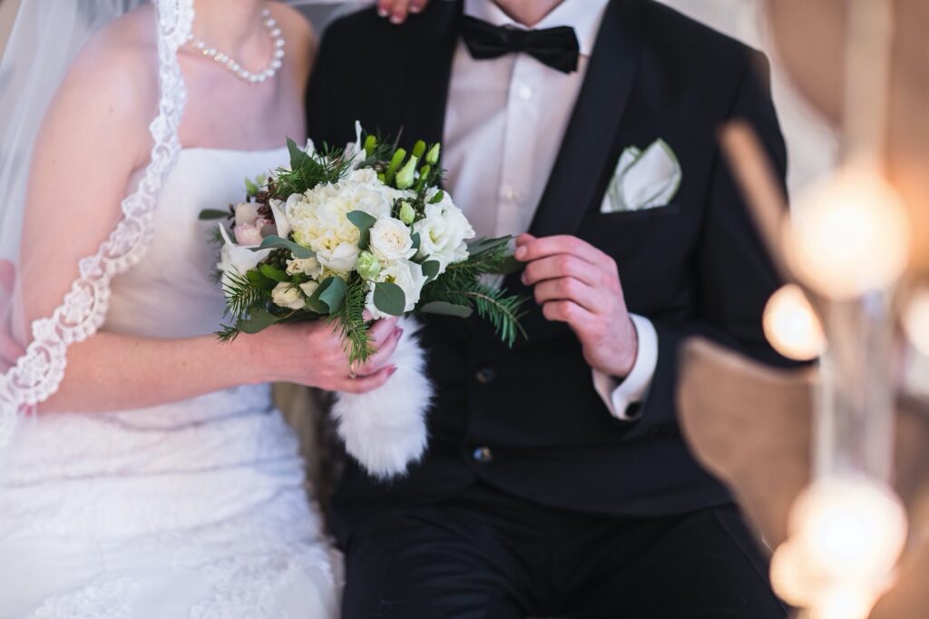 A person and person holding flowers Description automatically generated with low confidence