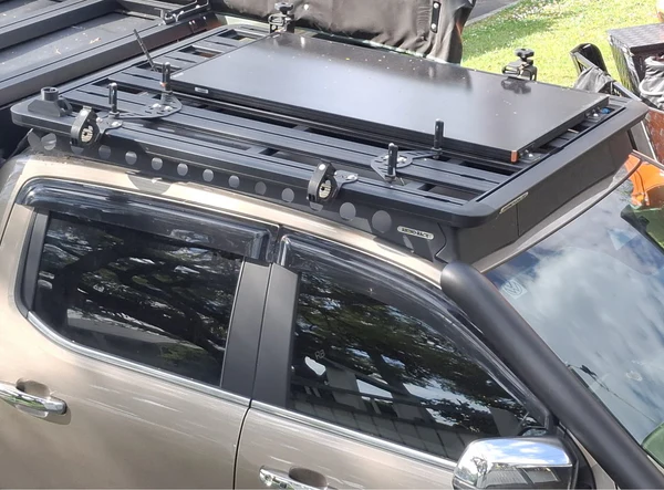 A 4WD fitted with a fixed solar panel on the roof