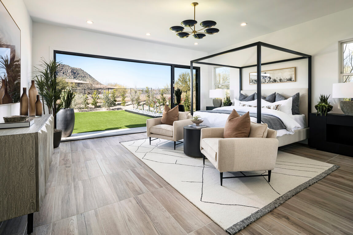 Modern bedroom featuring indoor-outdoor transitions to the backyard