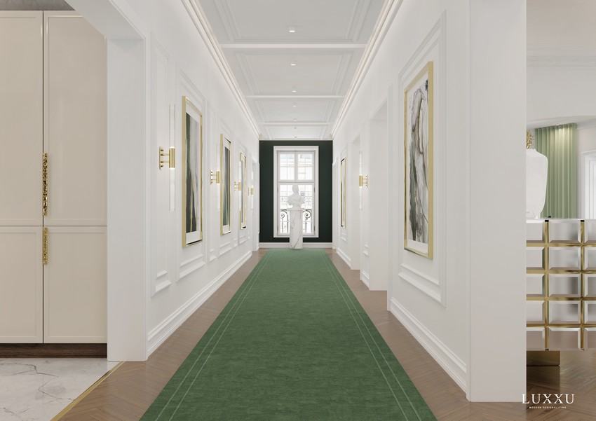 entryway design with a big green rug and golden wall lamps