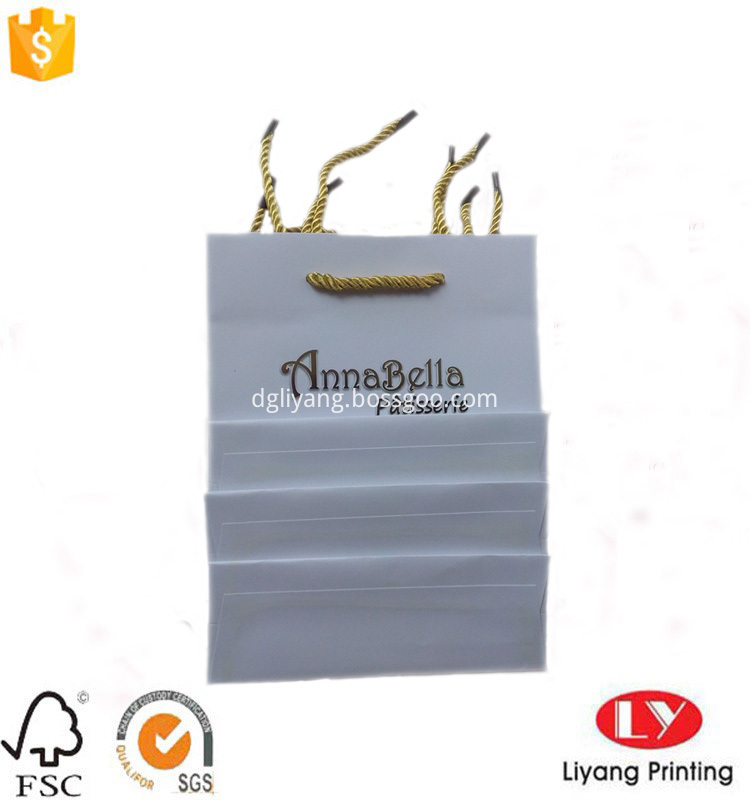 paper bag with gold handle