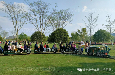 Children ride the steam locomotive train to celebrate Children's Day