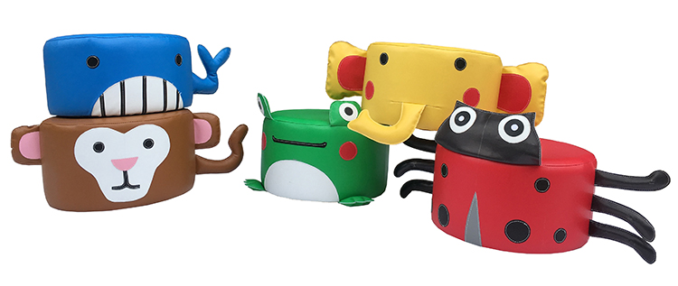 Children's indoor play area with cartoon-themed circular stools and soft play equipment