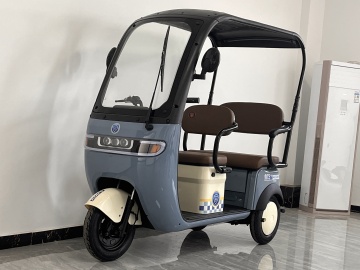 Electric tricycle with shed
