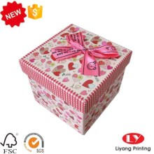 Cardboard ribbon gift packaging box with lid