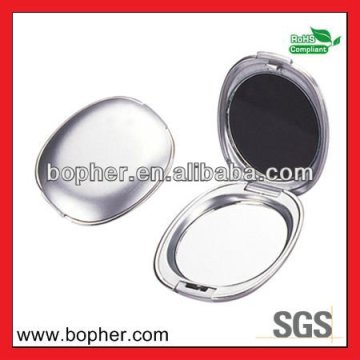 small metal oval pocket mirror