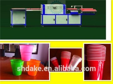 Plastic cup coiling machine