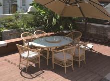 Outdoor Table with Rattan Chairs and Umbrella
