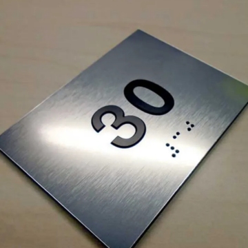 Custom designed ADA braille room number