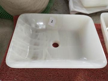 White round onyx vessel sink