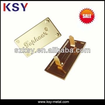 Gold metal handbag labels with debossed logo