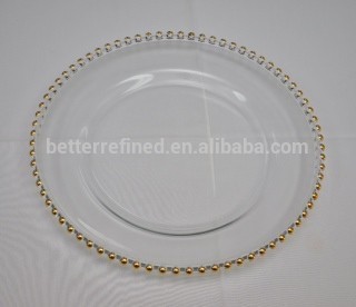 Clear glass chargers with gold beaded edge