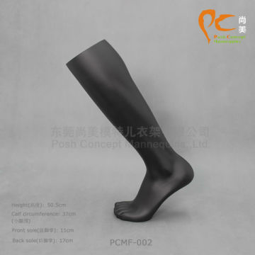 black plastic mannequin feet