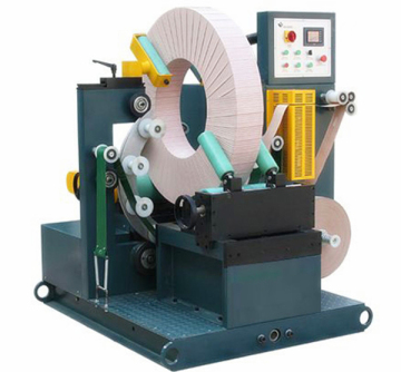 Wire rod coil ring wrapping machines