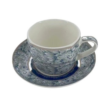 Ceramic coffee cup accompanied by a tray