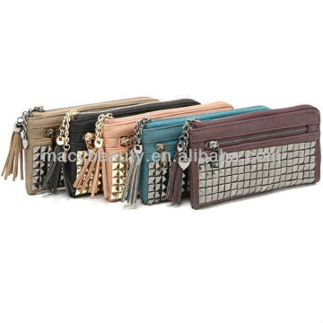 Rivet clutch bag with tassel