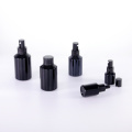 Slant shoulder matte black glass bottle with lid