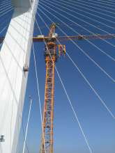 big outside walking climbing fixing hammer tower crane