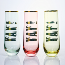 colored champagne glass with gold rim
