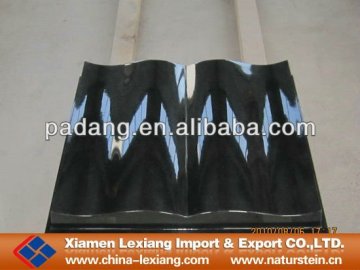 Black marble stone book sculpture