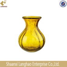 The traditional amber bulb round flat glass vase