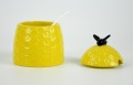 Keramik canister makanan berbentuk lebah kuning dengan penutup