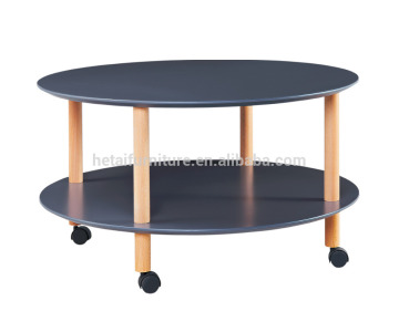 Round coffee table in wood with wheels