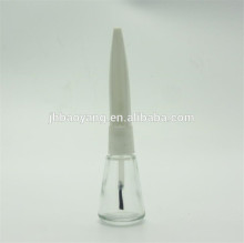 empty nail polish bottle with cap and brush