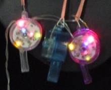 Plastic flashing whistle