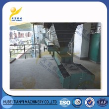 En-masse conveyor for coal feeding systems